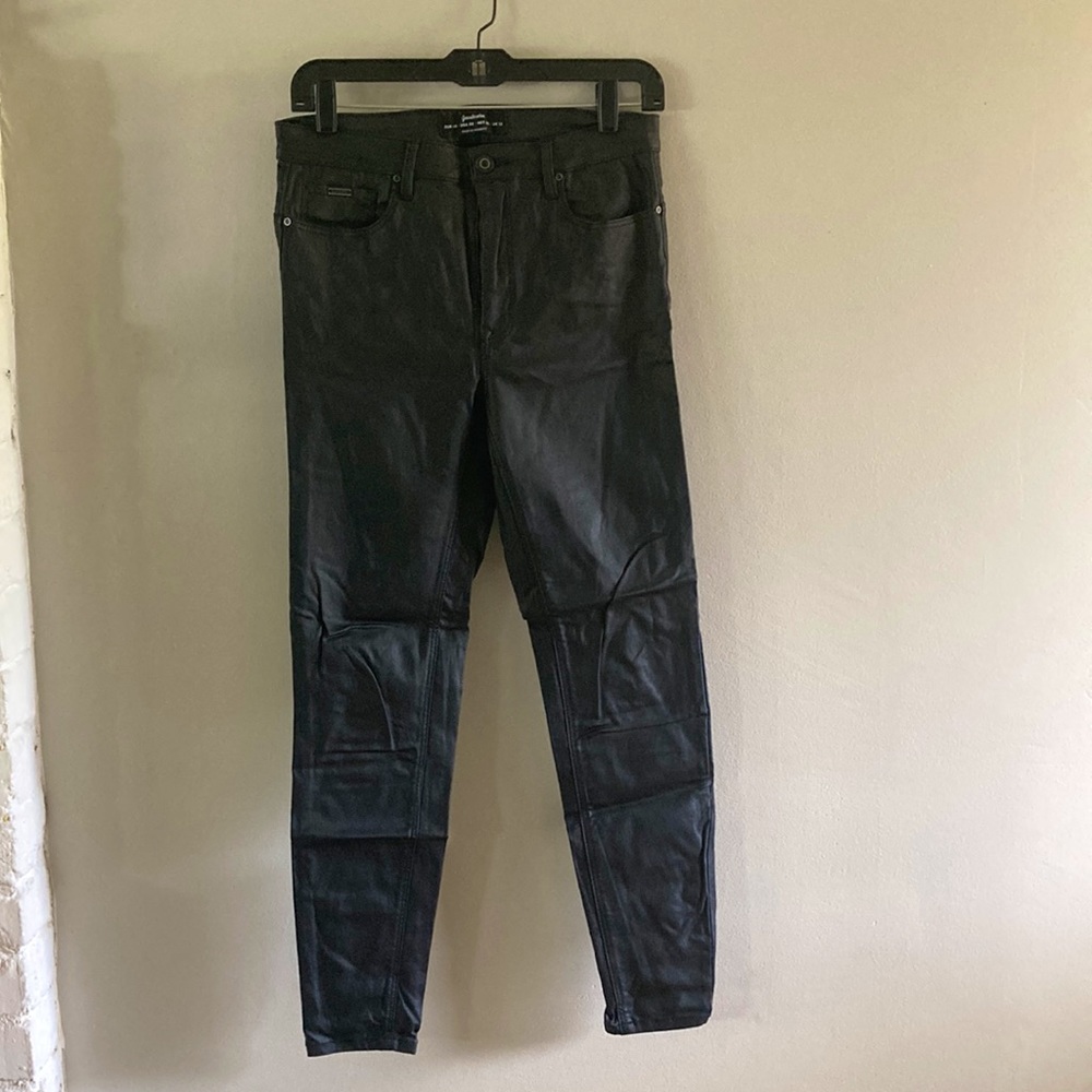 Black waxed denim leather-look jeans
